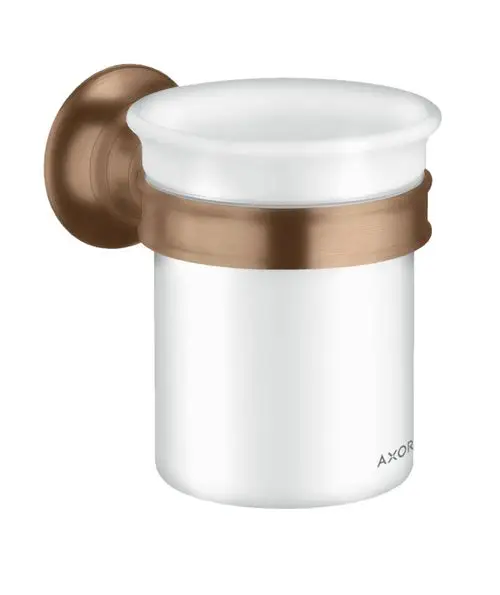 Zahnputzbecher in Weiß mit einer bronzefarbenen Halterung, montiert an der Wand. Produkt von AXOR.